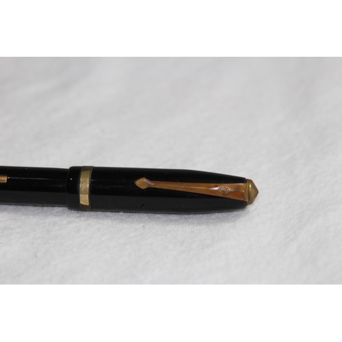 1224 - 14CT GOLD NIB CONWAY FOUNTAIN PEN AND A YELLOW METAL TWIST ACTION PENCIL MARKED R.M AND CO