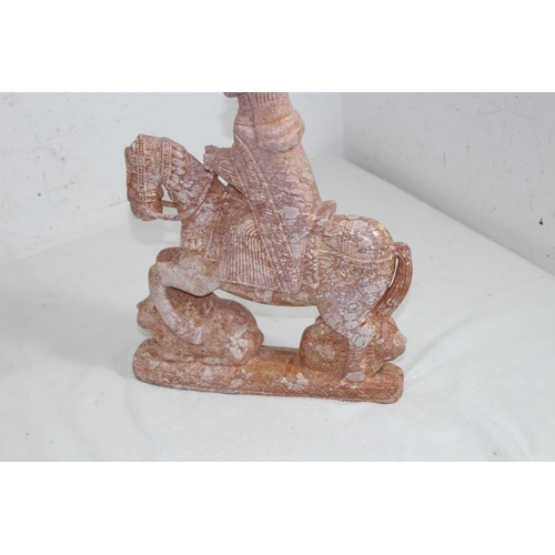 621 - POLISHED STONE FIGURE ON HORSEBACK 
35 X 26CM