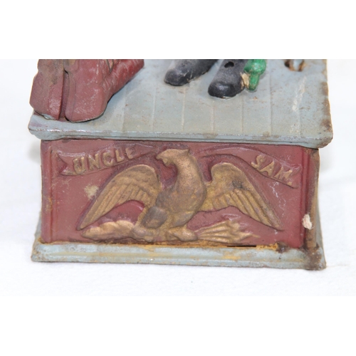 957 - NOVELTY CAST MONEY BOX
29 X 12 X 9CM