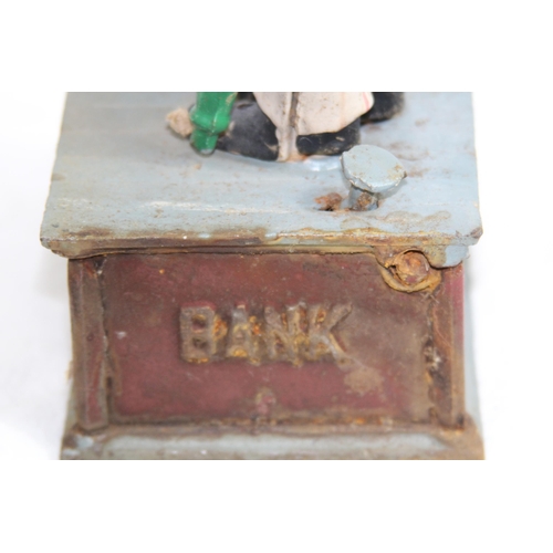 957 - NOVELTY CAST MONEY BOX
29 X 12 X 9CM