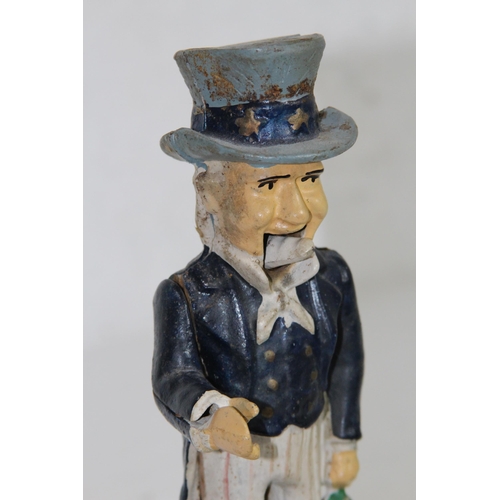 957 - NOVELTY CAST MONEY BOX
29 X 12 X 9CM