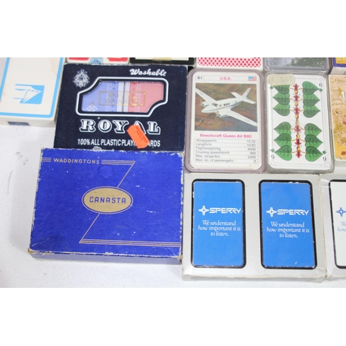 704 - LARGE QUANTITY OF PLAYING CARDS AND OTHER GAMES