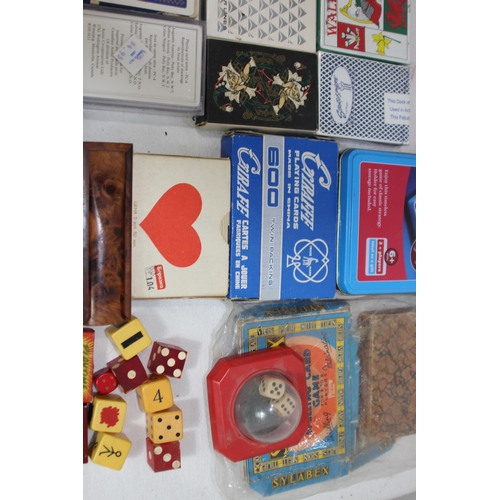 704 - LARGE QUANTITY OF PLAYING CARDS AND OTHER GAMES