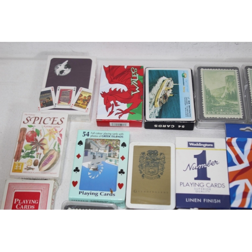 704 - LARGE QUANTITY OF PLAYING CARDS AND OTHER GAMES