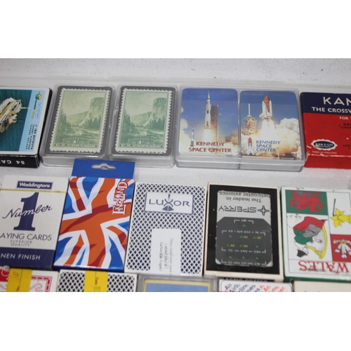 704 - LARGE QUANTITY OF PLAYING CARDS AND OTHER GAMES