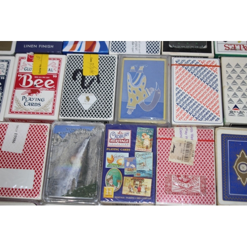 704 - LARGE QUANTITY OF PLAYING CARDS AND OTHER GAMES