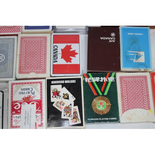 704 - LARGE QUANTITY OF PLAYING CARDS AND OTHER GAMES