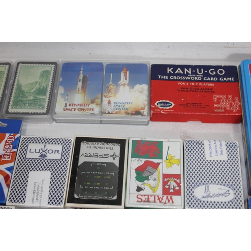 704 - LARGE QUANTITY OF PLAYING CARDS AND OTHER GAMES