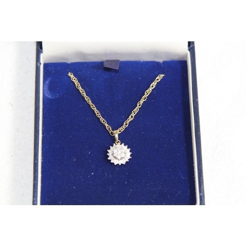 1221 - 9CT GOLD DIAMOND CLUSTER NECKLACE WITH A MIXTURE OF BRILLIANT AND BAGUETTE CUT DIAMONDS RETAILED BY ... 