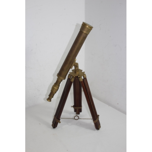 438 - NAUTICALIA BRASS TELESCOPE ON TRIPOD BASE