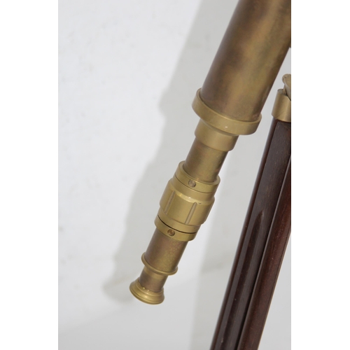 438 - NAUTICALIA BRASS TELESCOPE ON TRIPOD BASE