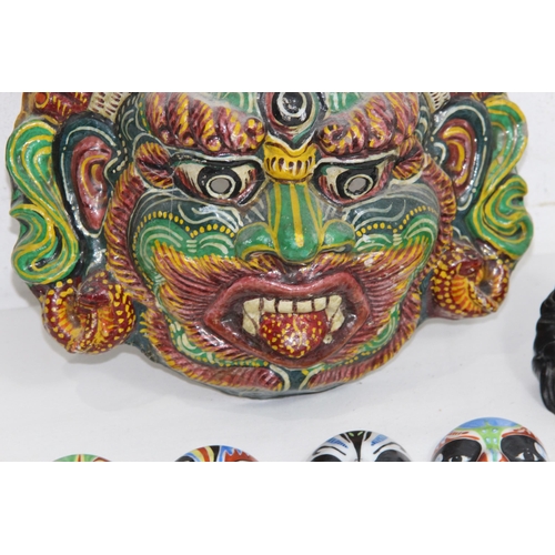 446 - QUANTITY OF VINTAGE EASTERN MASKS AND BUDDA
30 X 25CM