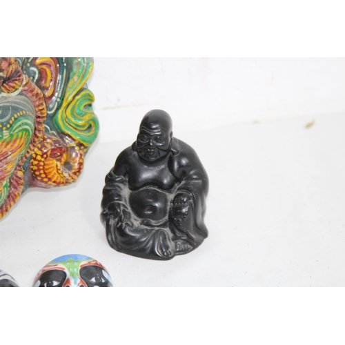 446 - QUANTITY OF VINTAGE EASTERN MASKS AND BUDDA
30 X 25CM