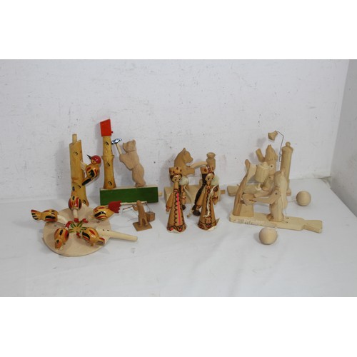 469 - QUANTITY OF WOODEN CARVED MOVING MODELS ETC 
15 X 14CM