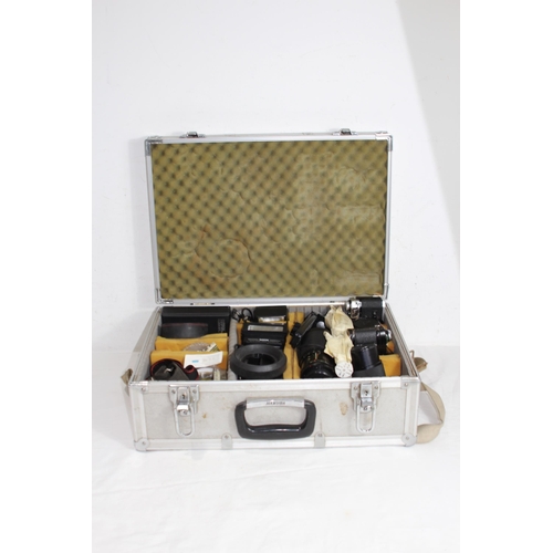 722 - QUANTITY OF CASED CAMERA EQUIPMENT INCLUDING CANON CAMERA AND VARIOUS LENSES ETC