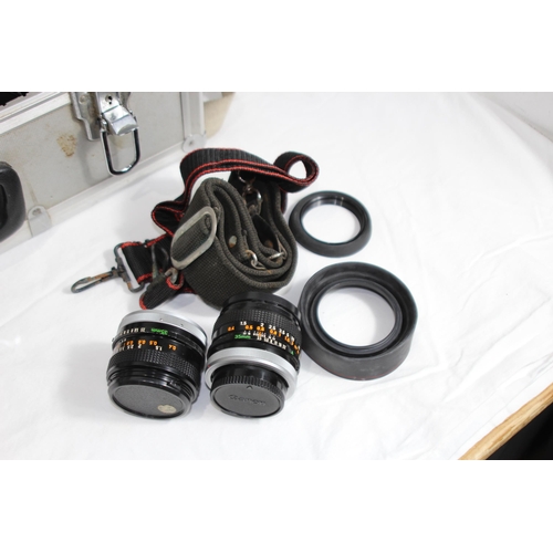 722 - QUANTITY OF CASED CAMERA EQUIPMENT INCLUDING CANON CAMERA AND VARIOUS LENSES ETC