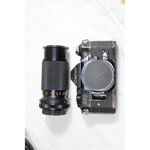 722 - QUANTITY OF CASED CAMERA EQUIPMENT INCLUDING CANON CAMERA AND VARIOUS LENSES ETC