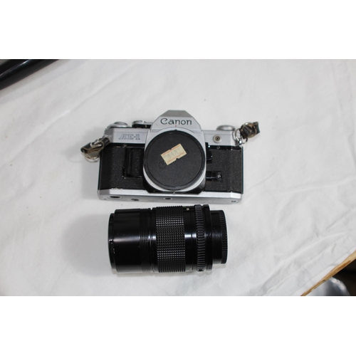 722 - QUANTITY OF CASED CAMERA EQUIPMENT INCLUDING CANON CAMERA AND VARIOUS LENSES ETC