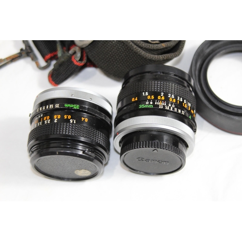 722 - QUANTITY OF CASED CAMERA EQUIPMENT INCLUDING CANON CAMERA AND VARIOUS LENSES ETC