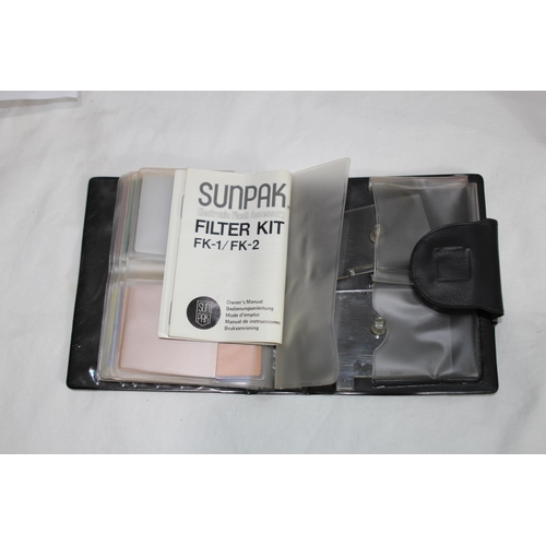 722 - QUANTITY OF CASED CAMERA EQUIPMENT INCLUDING CANON CAMERA AND VARIOUS LENSES ETC
