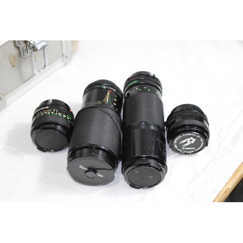 722 - QUANTITY OF CASED CAMERA EQUIPMENT INCLUDING CANON CAMERA AND VARIOUS LENSES ETC