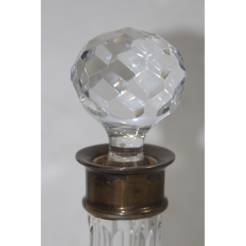 1071 - PAIR OF SILVER COLLARED DECANTERS