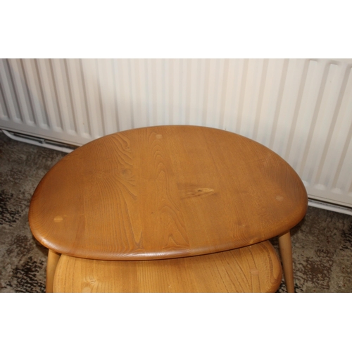 24 - MID CENTURY BLONDE ERCOL PEBBLE NEST 
66 X 44 X 40CM