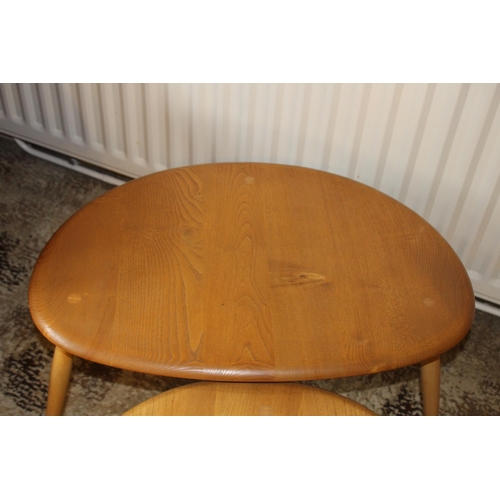 24 - MID CENTURY BLONDE ERCOL PEBBLE NEST 
66 X 44 X 40CM