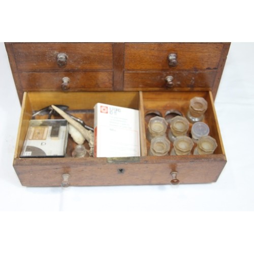 390 - INTERESTING VINTAGE DENTISTRY CABINET DOUBLE SIDED WITH LARGE AMOUNT OF CONTENTS 
36 X 36 X 23CM