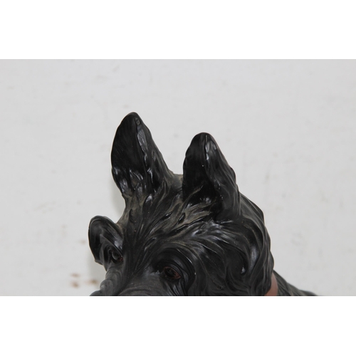 299 - RESIN FIGURE OF A WESTIE SCOTTIE DOG
35 X 38CM