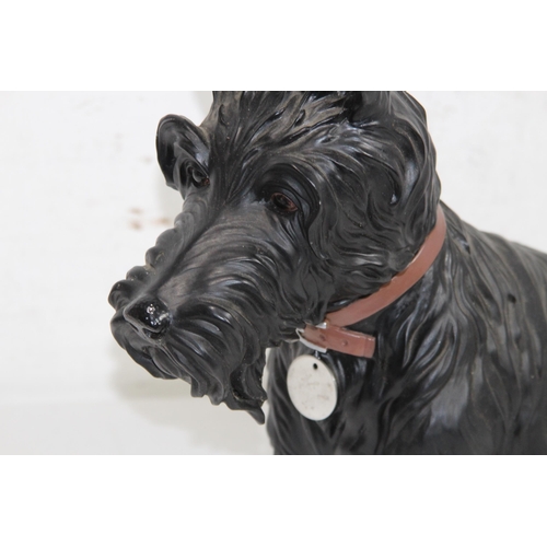 299 - RESIN FIGURE OF A WESTIE SCOTTIE DOG
35 X 38CM