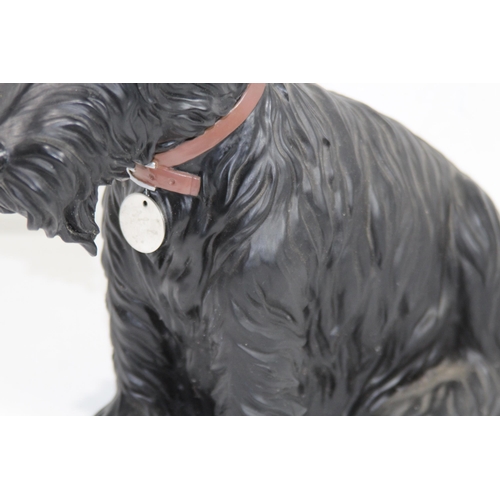 299 - RESIN FIGURE OF A WESTIE SCOTTIE DOG
35 X 38CM