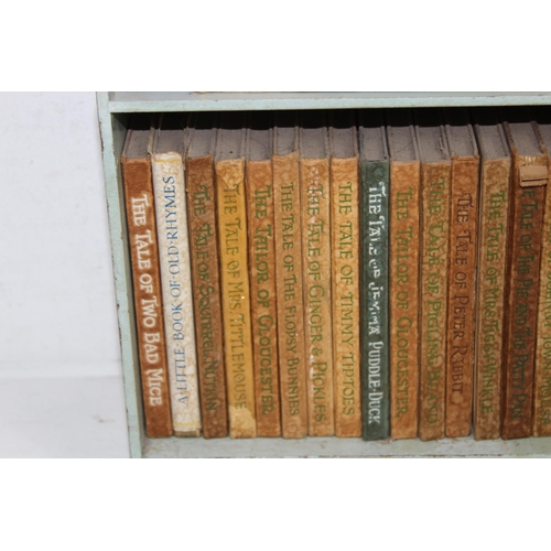 395 - BEATRICE POTTER PETER RABBIT BOOK SHELF AND CONTENTS
28 X 28 X 13CM