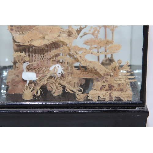 396 - ORIENTAL CORK CARVED DISPLAY IN CASE
8 X 11.5 X 18CM