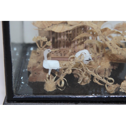 396 - ORIENTAL CORK CARVED DISPLAY IN CASE
8 X 11.5 X 18CM