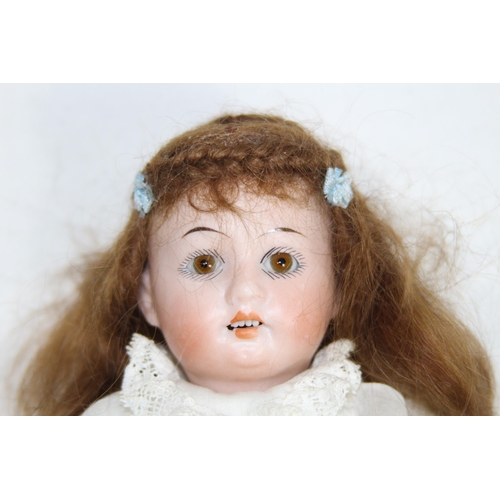 703 - ANTIQUE BISQUE GERMAN DOLL
24CM