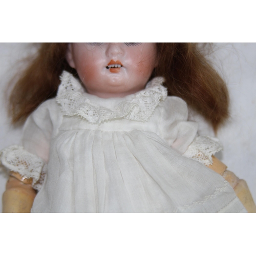 703 - ANTIQUE BISQUE GERMAN DOLL
24CM