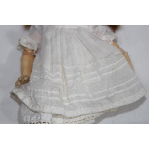 703 - ANTIQUE BISQUE GERMAN DOLL
24CM