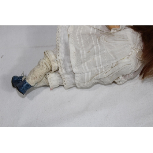 703 - ANTIQUE BISQUE GERMAN DOLL
24CM