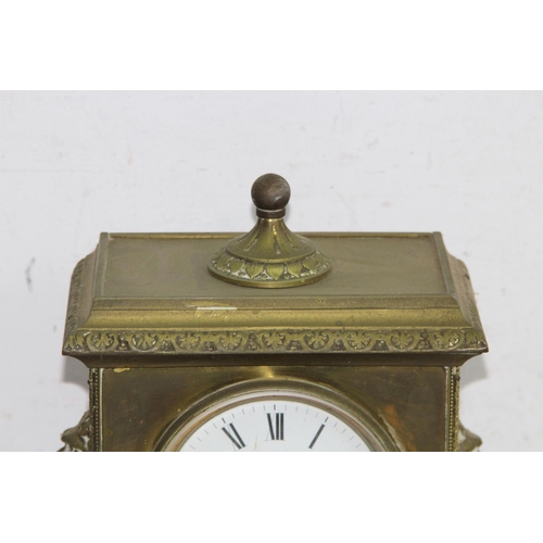 420 - ANTIQUE BRASS CLOCK
23 X 30 X 14CM