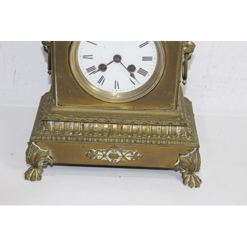 420 - ANTIQUE BRASS CLOCK
23 X 30 X 14CM