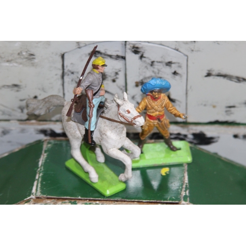 713 - BRITTANS AND TEMPO COWBOY AND INDIAN FIGURES AND FORT
46 X 30CM