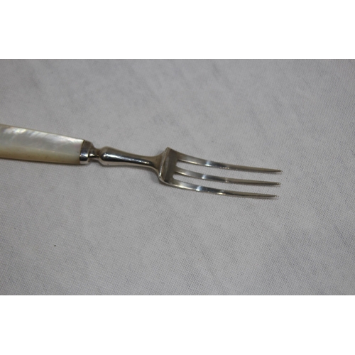 1096 - SILVER BLADED AND TINED KNIFE AND FORK WITH MOTHER OF PEARL HANDLE - GROSS WEIGHT 91.2G - M H AND CO... 