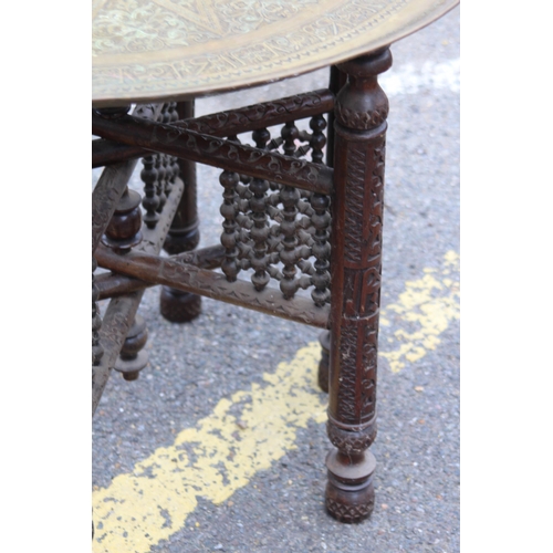 6 - VINTAGE ETHNIC BRASS TOPPED TABLE 
70 X 58CM