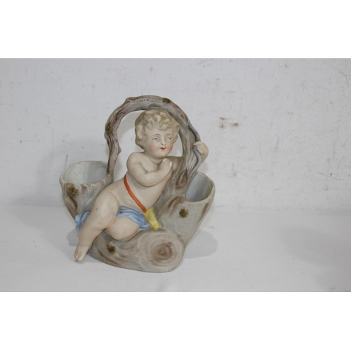 340 - PAIR OF BISQUE POSY HOLDERS DEPICTING CHERUBS
17 X 15CM