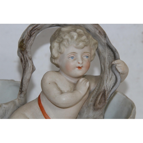 340 - PAIR OF BISQUE POSY HOLDERS DEPICTING CHERUBS
17 X 15CM