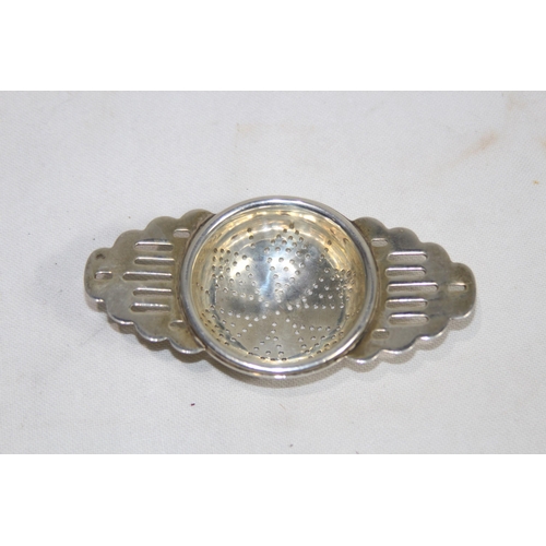 1128 - HALLMARKED SILVER TEA STRAINER - 40G