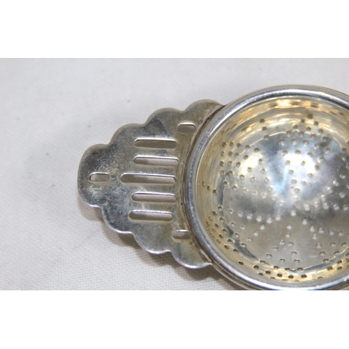 1128 - HALLMARKED SILVER TEA STRAINER - 40G