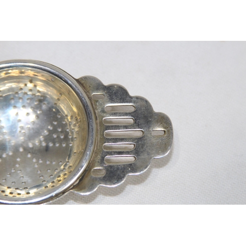 1128 - HALLMARKED SILVER TEA STRAINER - 40G