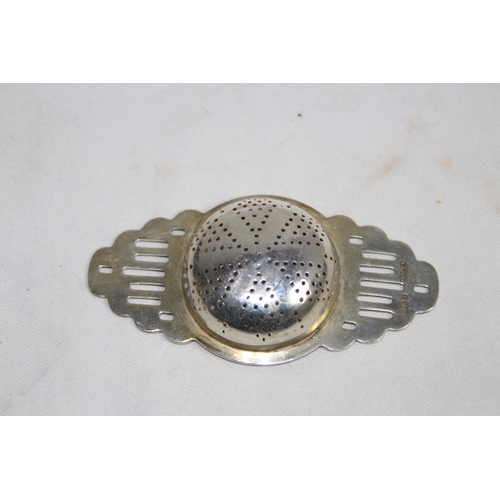 1128 - HALLMARKED SILVER TEA STRAINER - 40G